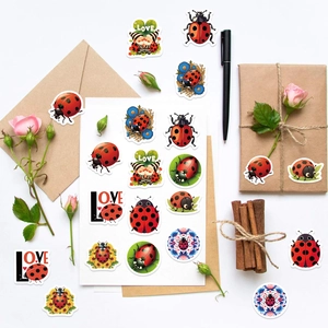 Detail showing cartoon ladybug stickers used for sealing kraft envelopes and gift boxes