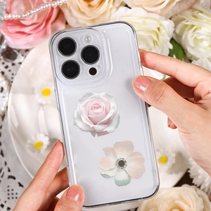 Detailed view of a transparent iPhone case featuring elegant pink rose and white flower prints