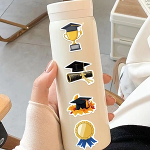 Waterproof graduation stickers with doctoral cap and trophy on a white thermal mug