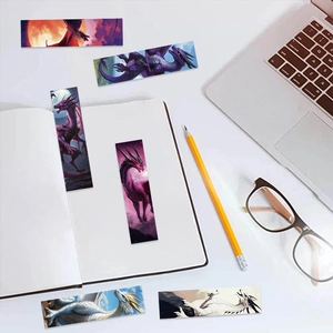 Macro detail of artistic dragon bookmarks styled with a notebook and laptop