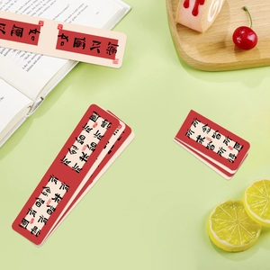 Traditional Chinese style magnetic bookmarks with calligraphy on a cozy reading desk
