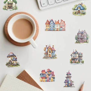 Detailed overhead shot of watercolor fairy house stickers on a desk with creative accessories