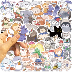 Close-up of hand holding a cute hand-drawn animal sticker with matte finish and white edge