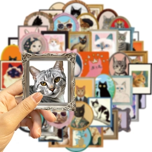 Detailed view of vintage frame cat stickers showing artistic variety and paper texture