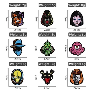 Macro shot of 9 cartoon horror alloy pins showing dimensions and enamel painting details