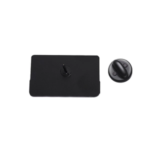 Detailed back view of vintage cassette badge with metal pin and black rubber clutch
