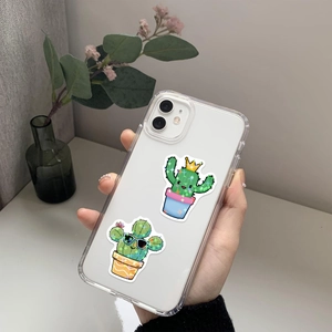 Close-up of clear phone case featuring two cute cartoon cacti with sunglasses and crowns