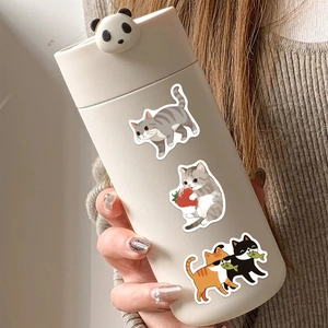 Creamy thermal bottle with 3D panda lid and cute cartoon cat patterns held in hand