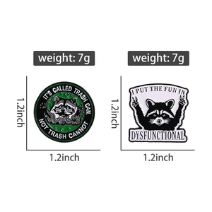 Detailed close-up of cartoon raccoon enamel pins showing 1.2-inch size and 7g weight