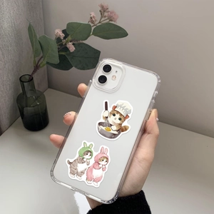 Detail of transparent phone case featuring cute chef and bunny cat stickers