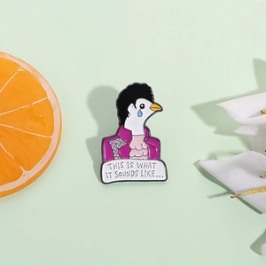 Creative enamel pigeon pin in purple jacket with lyrics against a green background