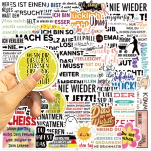 Detailed close-up of colorful German motivational stickers with lemon design and quotes