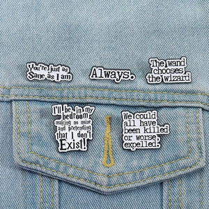 Five-piece Harry Potter enamel pin set with iconic movie quotes on blue denim background