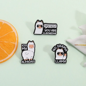 Three cartoon alpaca enamel pins set with sunglasses and funny llamazing slogans