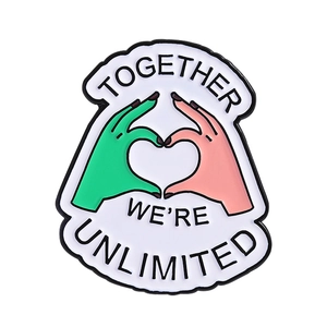 Together We Are Unlimited enamel pin with green and pink hands making a heart shape