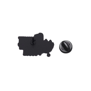 Detail view of the black metal enamel pin back with secure rubber clutch fastener