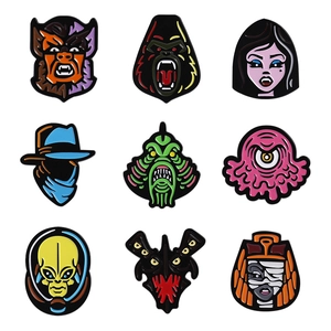 Set of nine creative horror movie character enamel pins and metal monster badges