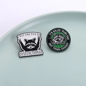 Funny raccoon enamel pin set with motivational quotes on a ceramic plate background