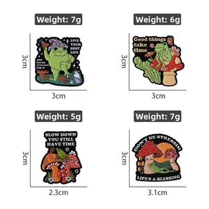 Set of four cartoon frog enamel pins with wizard hat and mushroom motifs, size 3cm