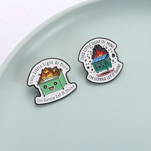 Cute green dumpster fire enamel pins set with humor text on light blue plate