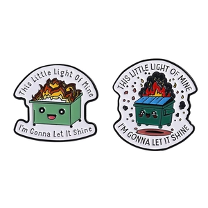 Cartoon enamel pins set featuring cute dumpster fire designs and inspirational quotes