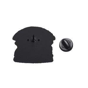 Detail of the black metal pin back with textured surface and black rubber clutch