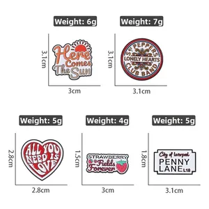 Detail view of The Beatles themed enamel pins with precise dimensions and weights