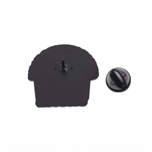 Detail of metal pin back with sharp needle and durable black rubber clutch closure