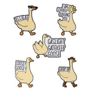 Set of 5 funny white goose enamel pins with quirky quotes and cartoon designs