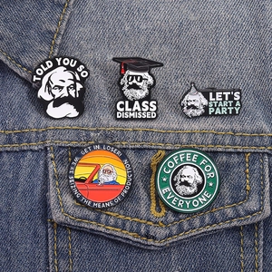 Cartoon Karl Marx enamel pins set on blue denim jacket pocket featuring pop art design