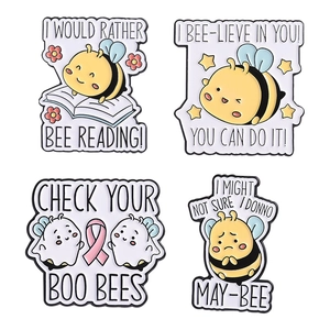 Set of four cute cartoon bee enamel pins with inspirational letter designs and metal finish