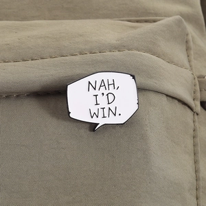 Nah I'd win speech bubble enamel pin attached to a khaki canvas backpack pocket