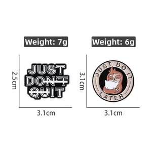 Detail view of cartoon sloth enamel pins with Just Don't Quit and Just Do It Later text