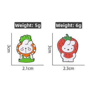 Detailed size and weight view of cartoon bunny pins in carrot and strawberry costumes