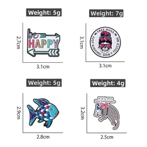 Detail view of colorful enamel pins featuring creative quotes and animal designs