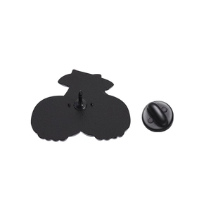 Detail view of cartoon enamel pin back with black finish and durable rubber clutch