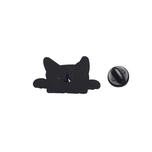 Close-up of black cat enamel pin back showing metal needle and rubber clutch