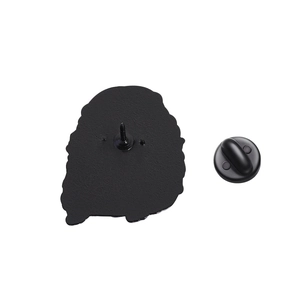 Detail view of the black enamel pin back with durable metal spike and rubber clutch