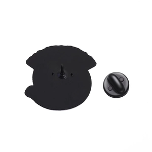 Detail view of the black rubber clutch and metal pin back for the animal badge