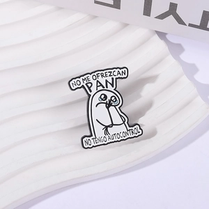 Funny black and white alloy brooch featuring a comic character and No Me Ofrezcan Pan quote