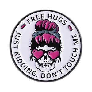 Round enamel skull brooch with pink heart sunglasses and motivational Free Hugs text
