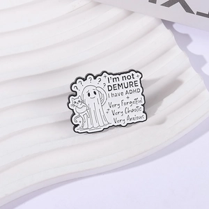 Ghost and cat enamel pin with ADHD text on a white textured display background