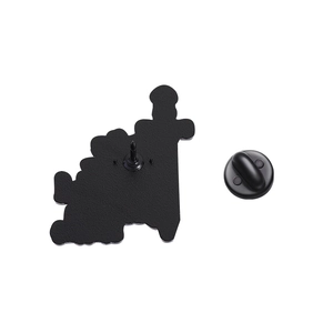 Macro shot of black matte metal badge back with needle and matching butterfly clasp