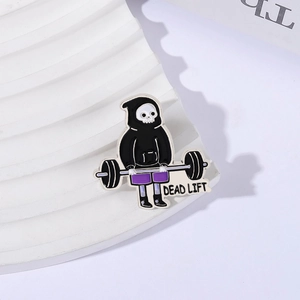 Skeleton lifting weights enamel pin with deadlift text for fitness enthusiasts