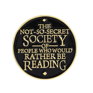 Round black enamel reading society pin badge with gold metallic border and text