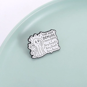 Cartoon ghost enamel pin with cat and ADHD text quote on minimalist green tray