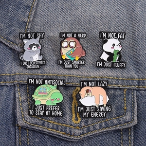 Five-piece cartoon animal enamel pins set with social quotes on denim jacket