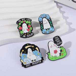 Set of four cute healing ghost enamel pins with inspirational quotes and stars