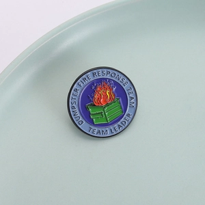 Dumpster Fire Response Team Leader enamel pin badge with creative flame design on a tray