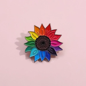 Colorful sunflower enamel pin with rainbow gradient petals and silver metal edging
